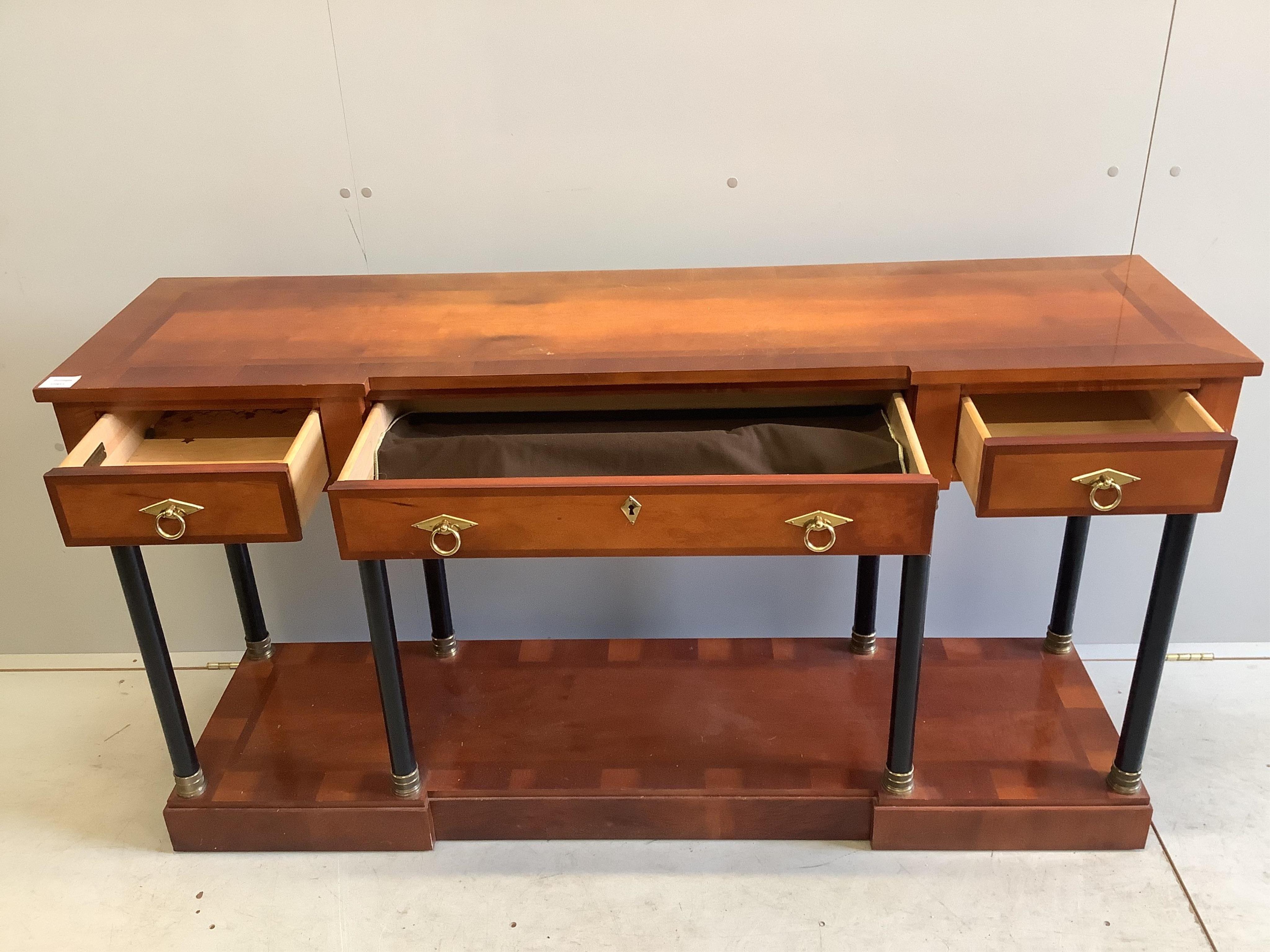 A French Empire style mahogany and ebonised three drawer console table, width 147cm, depth 41cm, height 79cm. Condition - fair to good